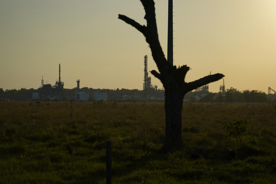 The Denka Performance Elastomer Plant sits at sunset in Reserve, La., Friday, Sept. 23, 2022. Less than a half mile away from the elementary school the plant, which is under scrutiny from federal officials, makes synthetic rubber, emitting chloroprene, listed as a carcinogen in California, and a likely one by the Environmental Protection Agency. (AP Photo/Gerald Herbert)