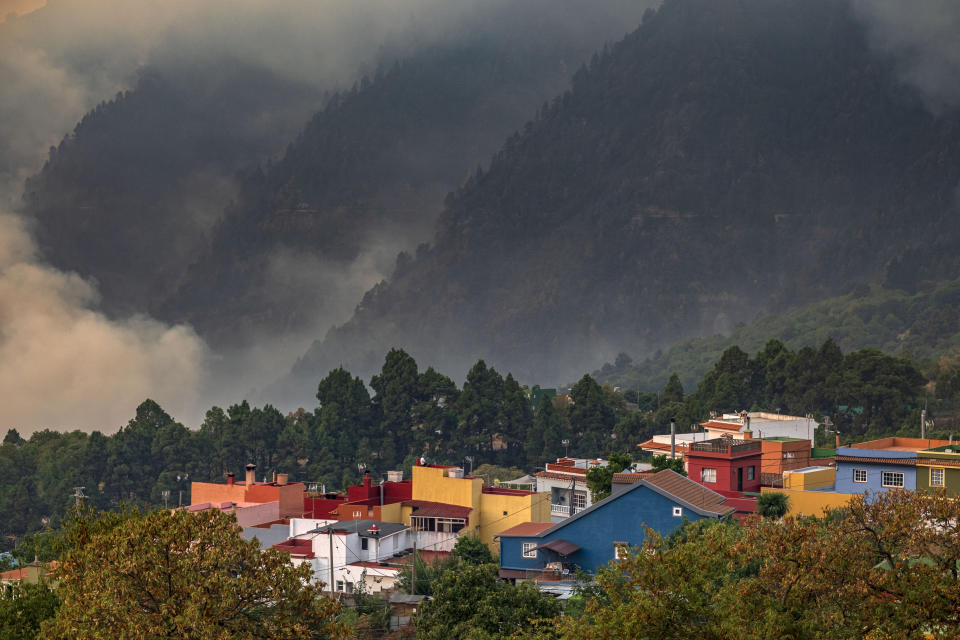 Fire advances through the forest in La Orotava in Tenerife, Canary Islands, Spain on Saturday, Aug. 19, 2023. Firefighters have battled through the night to try to bring under control the worst wildfire in decades on the Spanish Canary Island of Tenerife, a major tourist destination. The fire in the north of the island started Tuesday night and has forced the evacuation or confinement of nearly 8,000 people. Regional officials say Friday's efforts will be crucial in containing the fire. (AP Photo/Arturo Rodriguez)