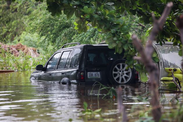 A vehicle is submerged in Salinas, Puerto Rico, on Monday. (Photo: Stephanie Rojas via Associated Press)