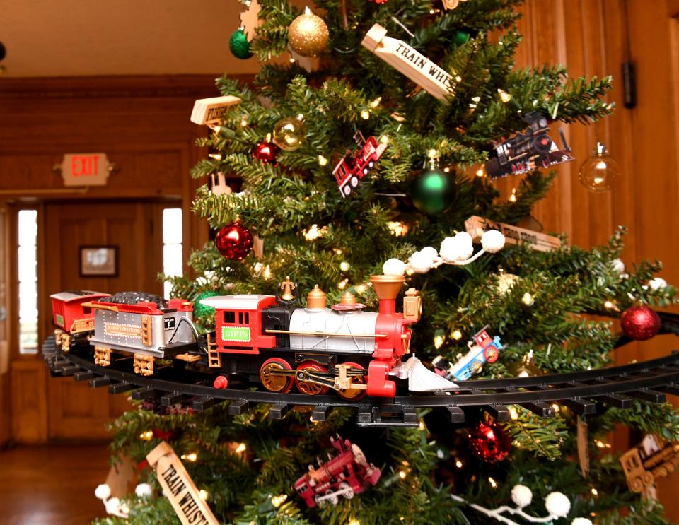 A train tree that will be auctioned at the Stewart Manor House is decorated for a holiday event at Quail Hollow Park in the Hartville area. "Welcome Home for the Holidays" and "Deck the Hollow" starts this weekend.