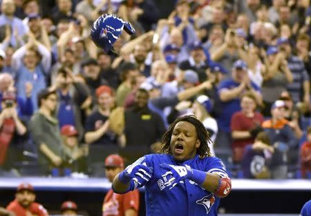 FILE PHOTO: Mar 27, 2018; Montreal, Quebec, CAN; Toronto Blue Jays infielder Vladimir Guerrero Jr. (27) reacts after hitting a home run in the ninth inning to defeat the St. Louis Cardinals at Olympic Stadium. Mandatory Credit: Eric Bolte-USA TODAY Sports