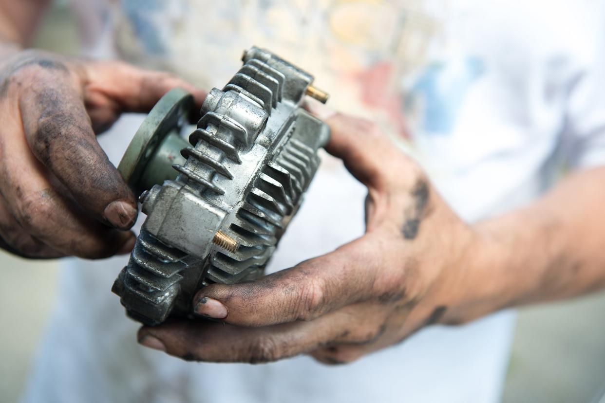 working man's greasy hands, and a fan clutch