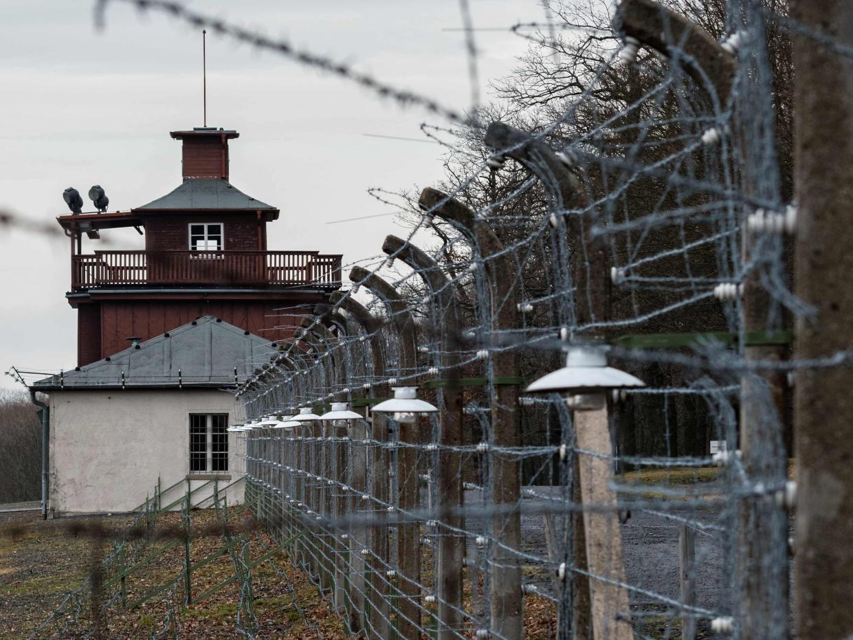 A barbed wire fence encloses the memorial site of the former Nazi concentration camp Buchenwald near Weimar, eastern Germany, on January 27, 2020. - A ceremony took place at the site to mark the International Holocaust Remembrance Day, 75 years after the liberation of the Auschwitz death camp in then occupied Poland. (Photo by JENS SCHLUETER / AFP) (Photo by JENS SCHLUETER/AFP via Getty Images)