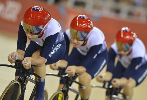 Britain's Dani King, Laura Trott and Joanna Rowsell compete in the London 2012 Olympic Games women's team pursuit final track cycling event at the Velodrome. Hosts Britain collected their fourth gold medal from five events at the Olympic Velodrome after the women's pursuit team triumphed in a new world record time of 3min 14.051sec