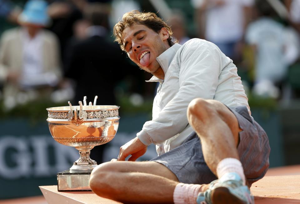 Rafael Nadal of Spain poses with the trophy during the ceremony after defeating Novak Djokovic of Serbia during their men's singles final match to win the French Open Tennis tournament in Paris