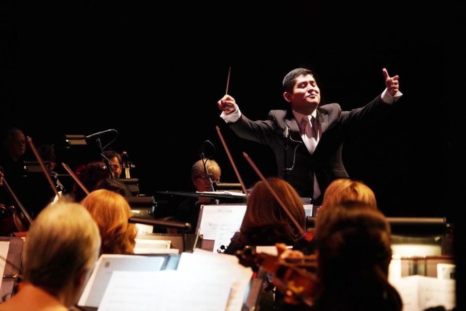 Isaac Terceros conducts the Bloomington Symphony Orchestra. He will be the interim conductor for the 2023-24 season.