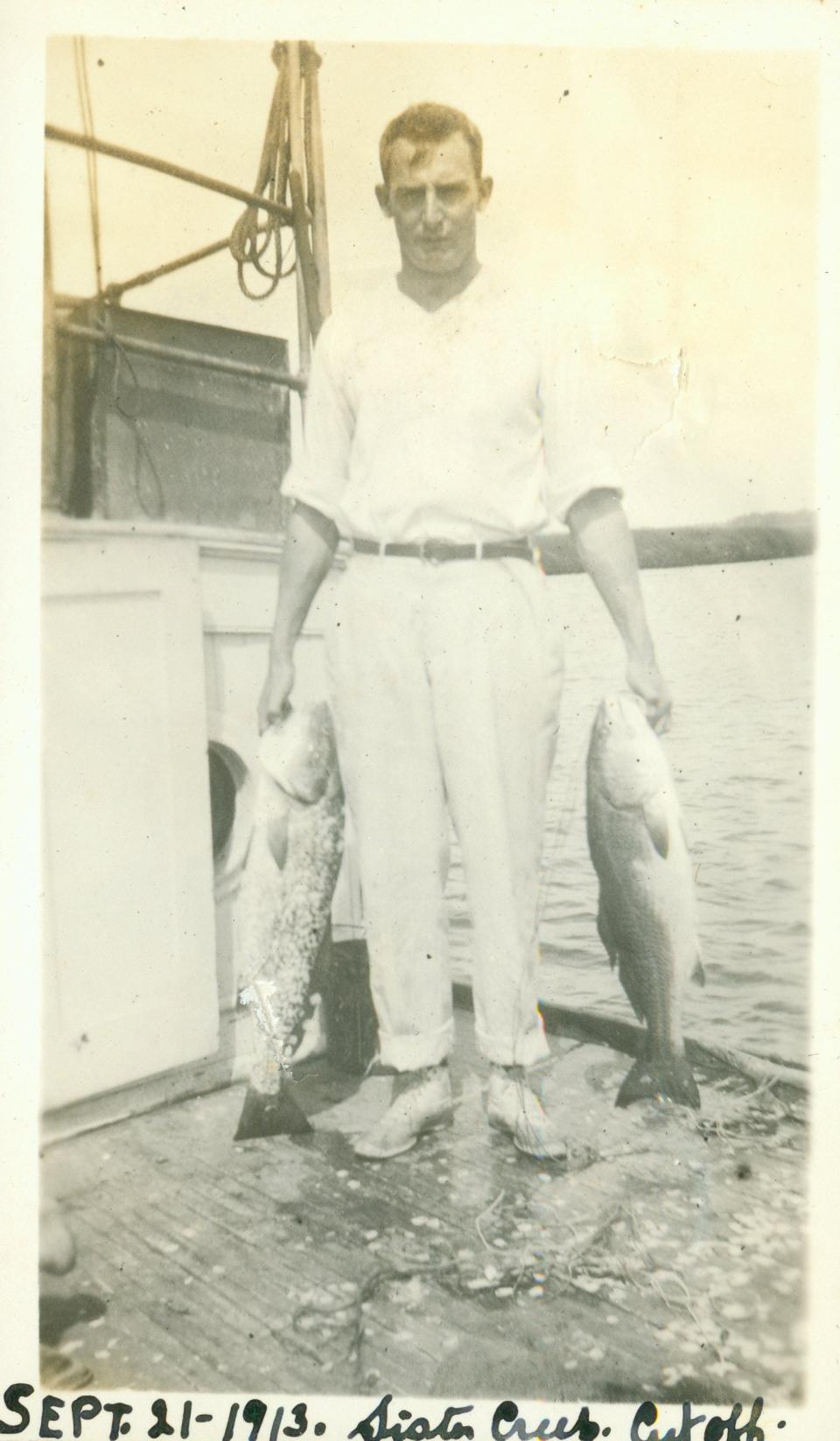 In 1913 an angler holds his catch at Sisters Creek as seen in Andrew Nicholas' book "Exploring the St. Johns River."