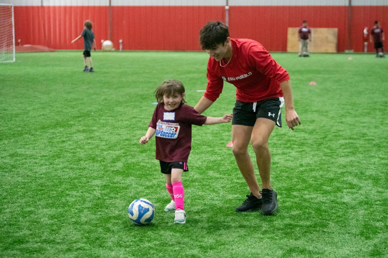 Colorado State University Pueblo's Will Boyle and Katie Mick, 4, run drills while participating in the Pueblo Rangers TOPSoccer program for children that have physical/developmental and cognitive/intellectual limitations on Wednesday, May 3, 2023.