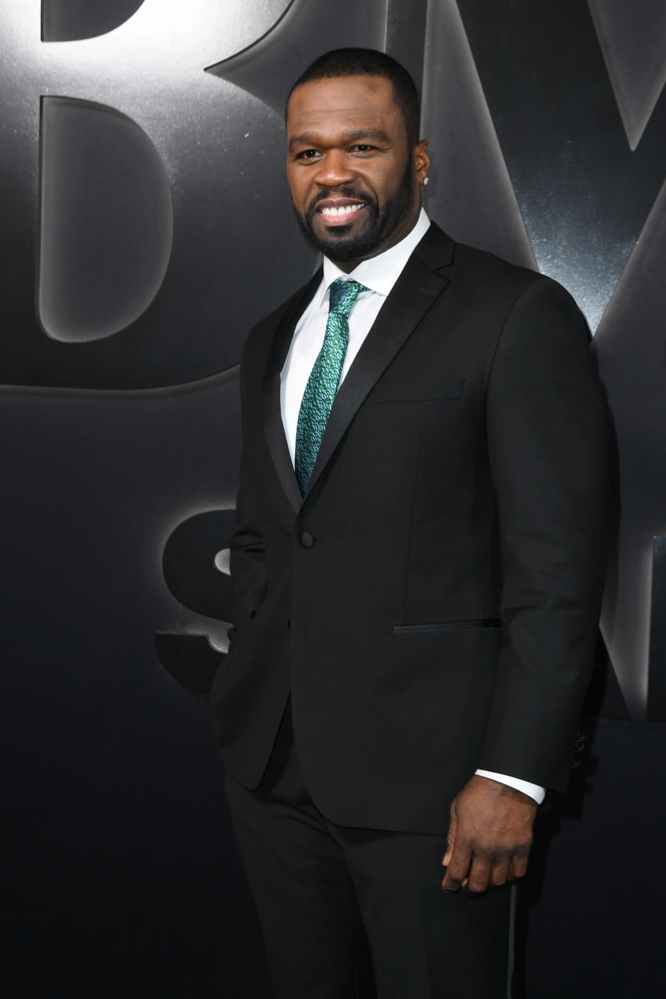 50 Cent wearing green tie. 