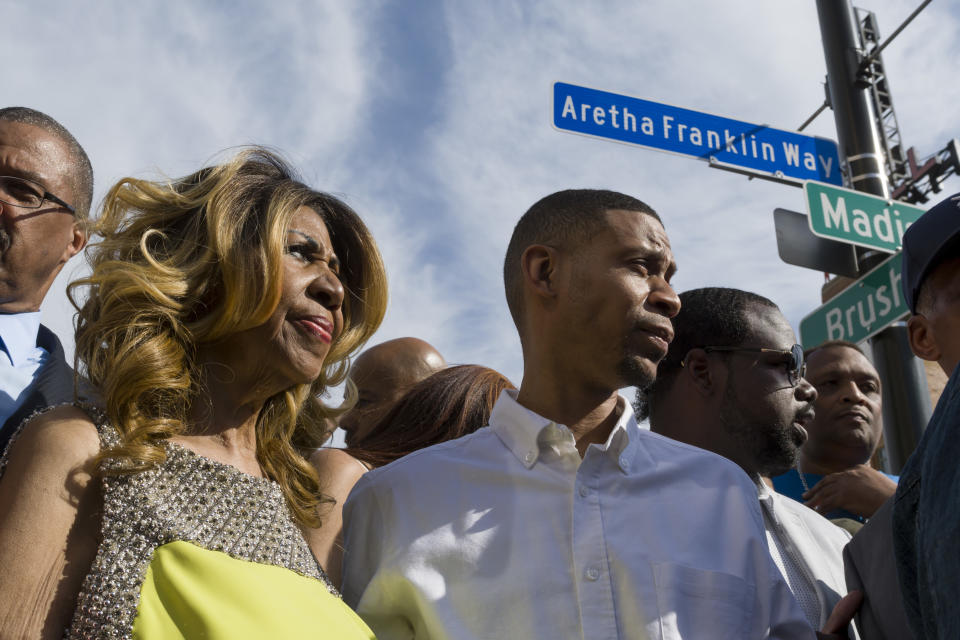 **HOLD FOR ED WHITE STORY** Aretha Franklin and her son Kecalf Cunningham stand under the newly unveiled street sign in front of the Music Hall in Detroit, June 8, 2017. (David Guralnick/Detroit News via AP)