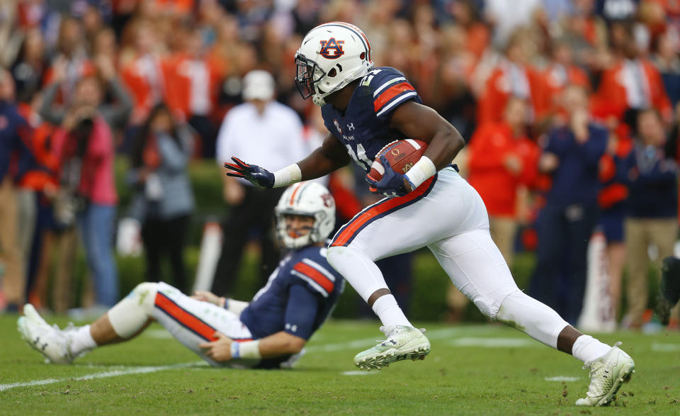 Auburn running back Kerryon Johnson runs the ball during the first half of the Iron Bowl NCAA college football game, Saturday, Nov. 25, 2017, in Auburn, Ala. (AP Photo/Butch Dill)