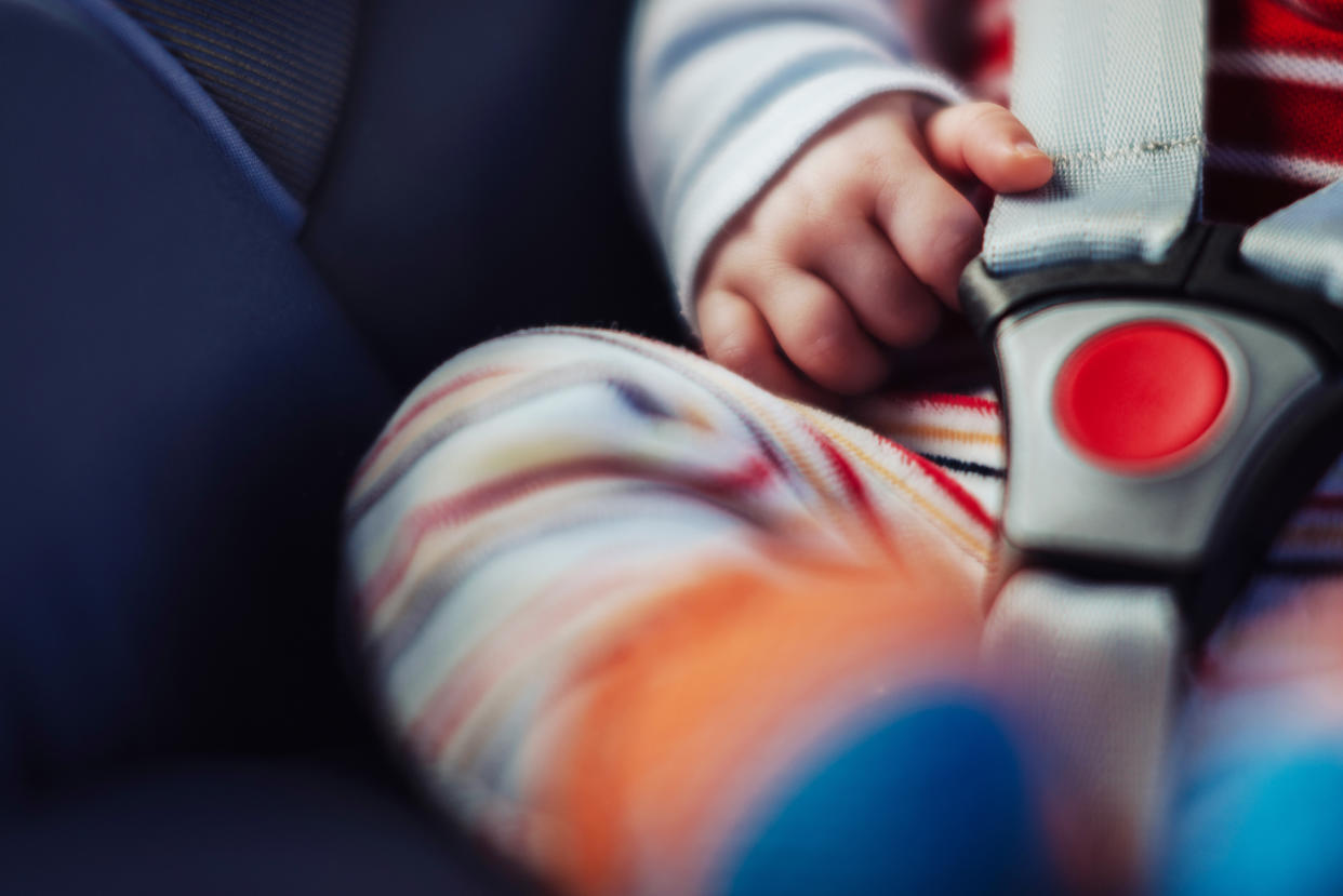 Child in a car seat.