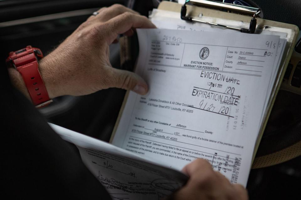 Sgt. John Furlong, Sr. of the Jefferson County Sheriff's Office goes through the day's eviction forms. Sept. 8, 2021