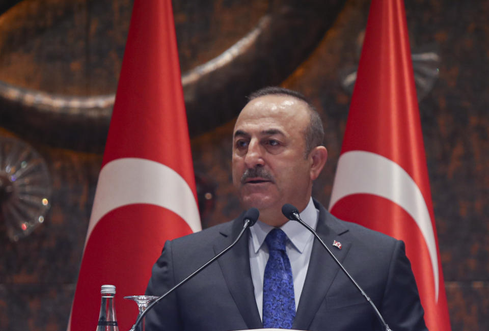 Turkish Foreign Minister Mevlut Cavusoglu speaks during a meeting in Ankara, Turkey, Tuesday, Feb. 4, 2020. Cavusoglu said Tuesday Ankara and Moscow were trying to keep peace efforts for Syria alive despite Syrian government advances and a deadly clash between Turkish and Syrian forces in northern Syria. (Turkish Foreign Ministry via AP, Pool)