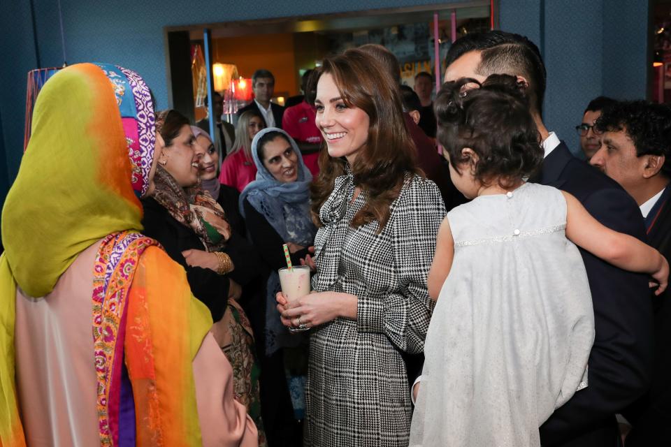 Britain's Catherine, Duchess of Cambridge reacts as she meets representatives from the UK Womens Muslim Council and women whose lives have benefitted from the Councils Curry Circle in Bradford on January 15, 2020. (Photo by Chris Jackson / POOL / AFP) (Photo by CHRIS JACKSON/POOL/AFP via Getty Images)