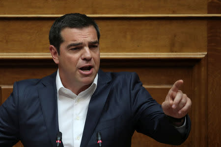 Greek Prime Minister Alexis Tsipras addresses lawmakers during a parliamentary session before a vote on tax breaks in Athens, Greece, May 15, 2019. REUTERS/Alkis Konstantinidis