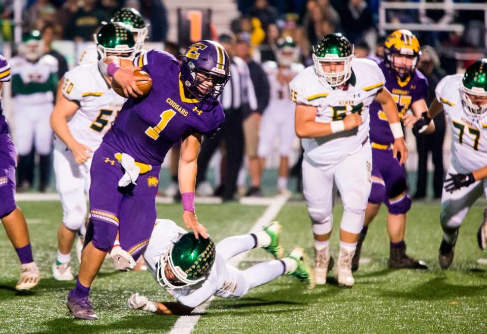 Escalon Highs Ryker Peters, 1, works his way around Hilmar Highs defense. Escalon High School took on Hilmar High football during the 2021 CIF Sac-Joaquin Football Playoffs - Division V at Saint Mary’s High School in Stockton, Ca. Escalon came out on top as the champions with a 20-13 win over Hilmar.