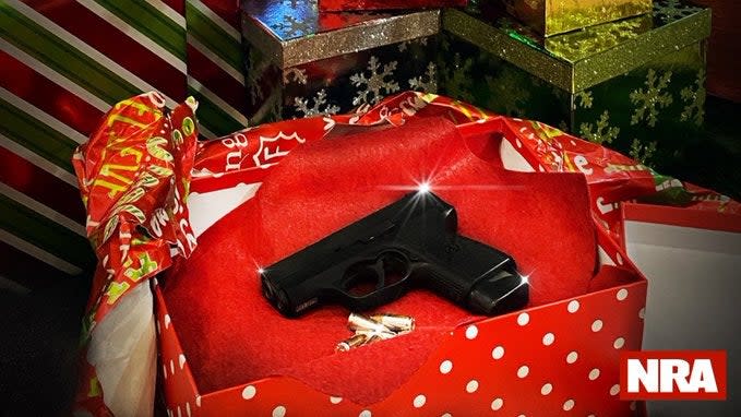 <p>NRA urges Americans to wrap guns for under the tree this Christmas</p> (NRA/Twitter)