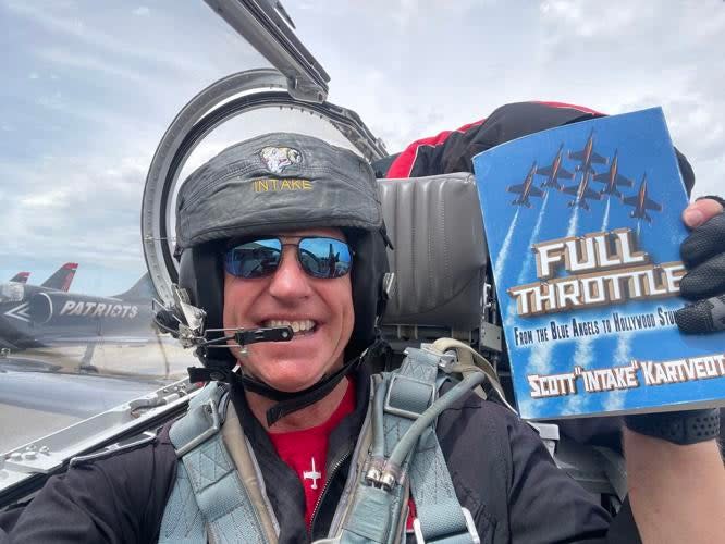 Scott celebrating being a newly minted published author in the cockpit of his L39 Albatross. (Scott Kartvedt)