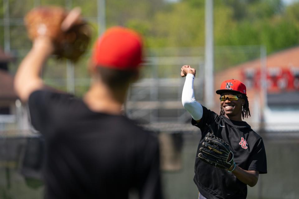 North Central High School junior Micah Rienstra-Kiracofe plays catch Thursday, May 4, 2023, during practice at North Central High School in Indianapolis.