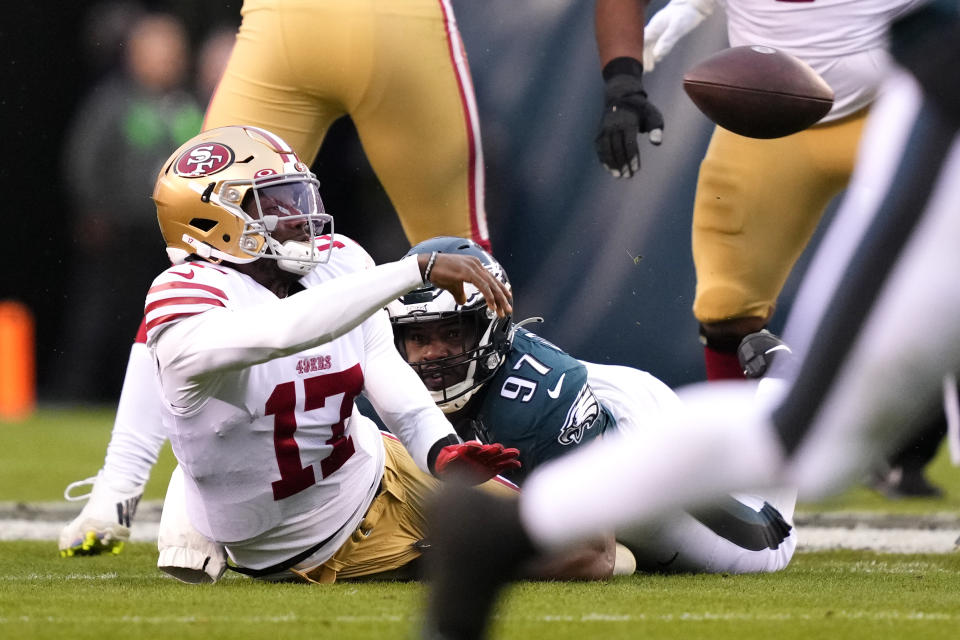 San Francisco 49ers quarterback Josh Johnson (17) passes after being is tackled by Philadelphia Eagles defensive tackle Javon Hargrave during the first half of the NFC Championship NFL football game between the Philadelphia Eagles and the San Francisco 49ers on Sunday, Jan. 29, 2023, in Philadelphia. (AP Photo/Matt Rourke)