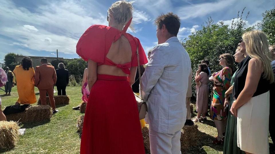 Zoe Ball showed off the back of her red wedding guest dress