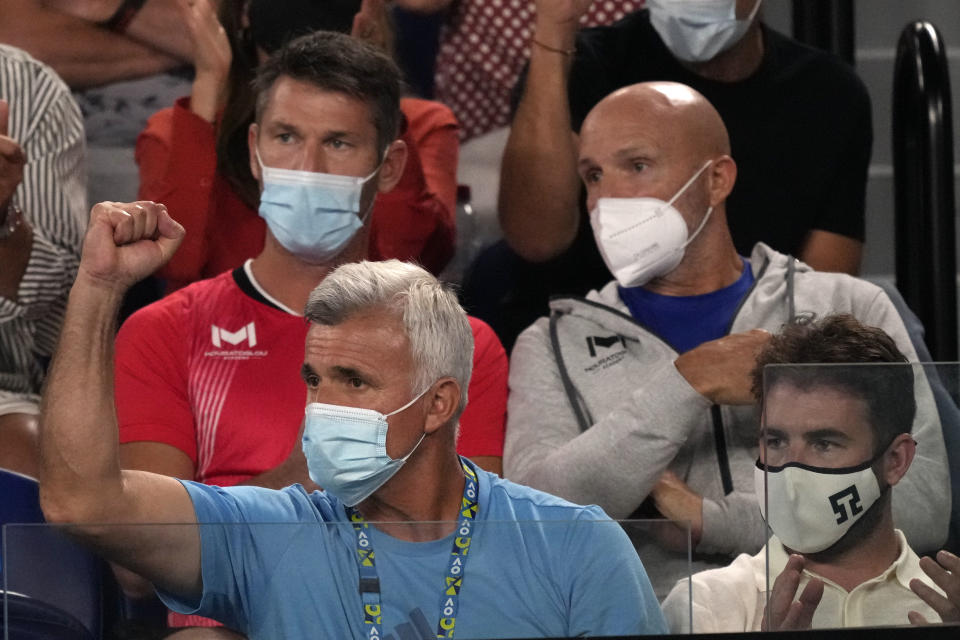 Apostolos Tsitsipas, father of Stefanos Tsitsipas of Greece gestures as he watches his son play Daniil Medvedev of Russia in their semifinal match at the Australian Open tennis championships in Melbourne, Australia, Friday, Jan. 28, 2022. (AP Photo/Simon Baker)