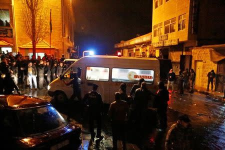 Jordanian policemen and an ambulance are seen in the vicinity of Karak Castle in the city of Karak, Jordan, December 18, 2016. REUTERS/Muhammad Hamed