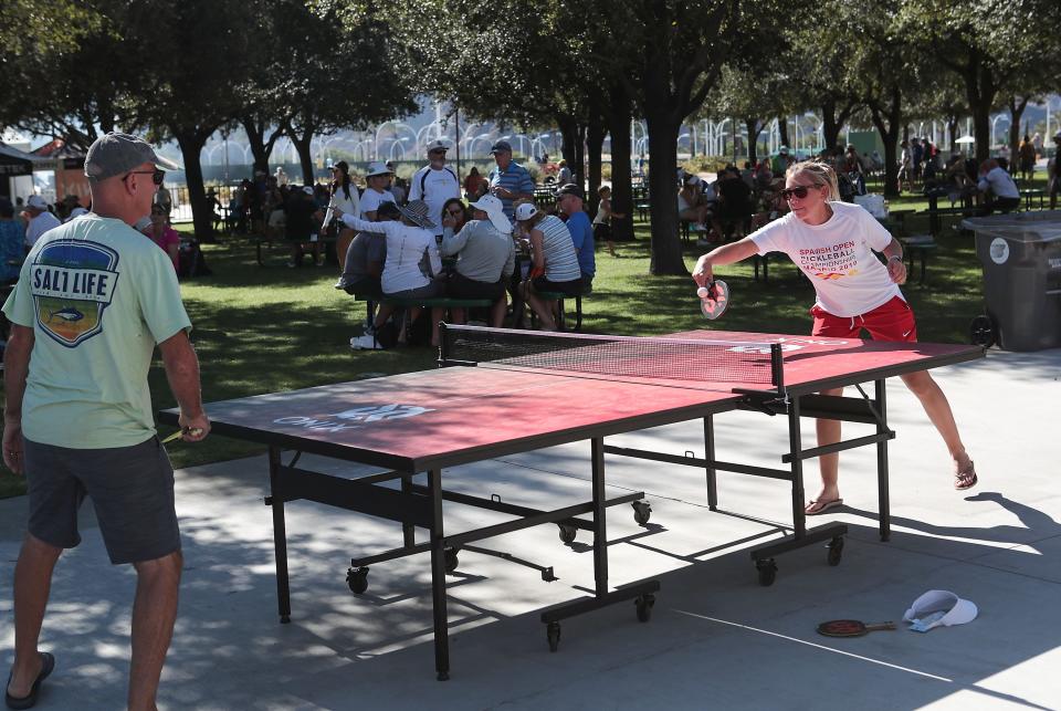 People relax and play during the Margaritaville USA Pickleball National Championships at the Indian Wells Tennis Garden, November 8, 2019.