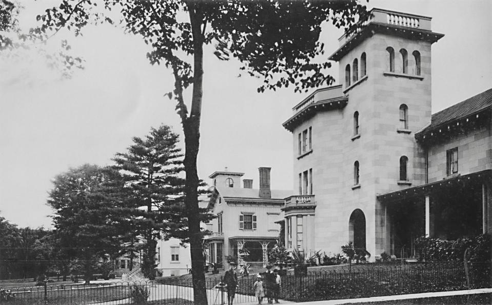 This scene shows historic Rutger Park in the early 20th century from its west end. The Italian Villa building on the right—1 Rutger Park—was built in about 1852 by Mary Jane Munn and her husband John. It is now owned by the Landmarks Society of Greater Utica.