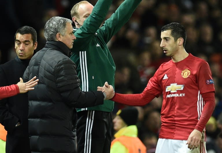 Manchester United's Henrikh Mkhitaryan (R) shakes hands with team manager Jose Mourinho as Mkhitaryan is substituted during a UEFA Europa League match in Manchester, in November 2016