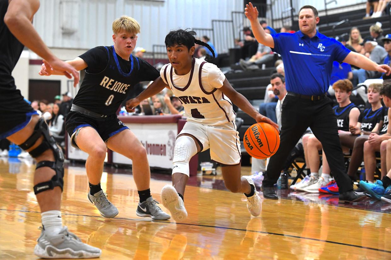 Nowata High School's Chelo Prince (4) handles the ball during basketball action at the Ty Hewitt Memorial Tournament in Nowata on Dec. 4, 2023. The Ironmen fell to Rejoice Christian, 77-49.