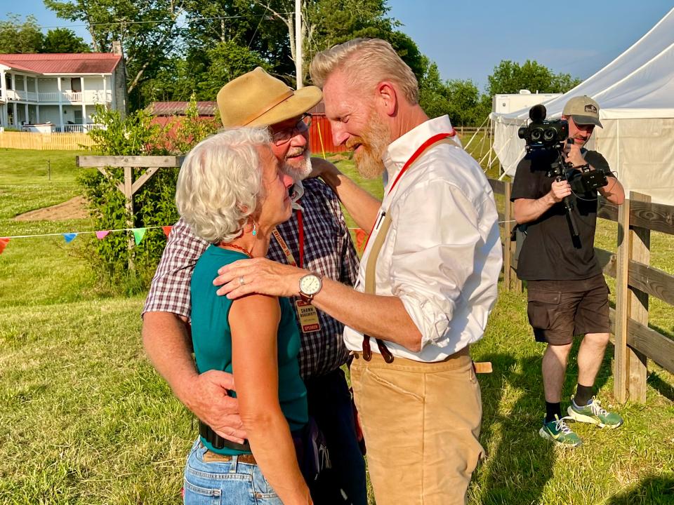 Rory Feek, right, visits with Shawn and Beth Doughtry, two Homestead Festival speakers who lost their home to a fire just days before the festival. Donations were collected throughout the weekend to support their recovery.