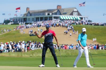 Jun 16, 2018; Southampton, NY, USA; Henrik Stenson reacts after putting the first green as Justin Rose looks on during the third round of the U.S. Open golf tournament at Shinnecock Hills GC - Shinnecock Hills Golf C. Brad Penner-USA TODAY Sports