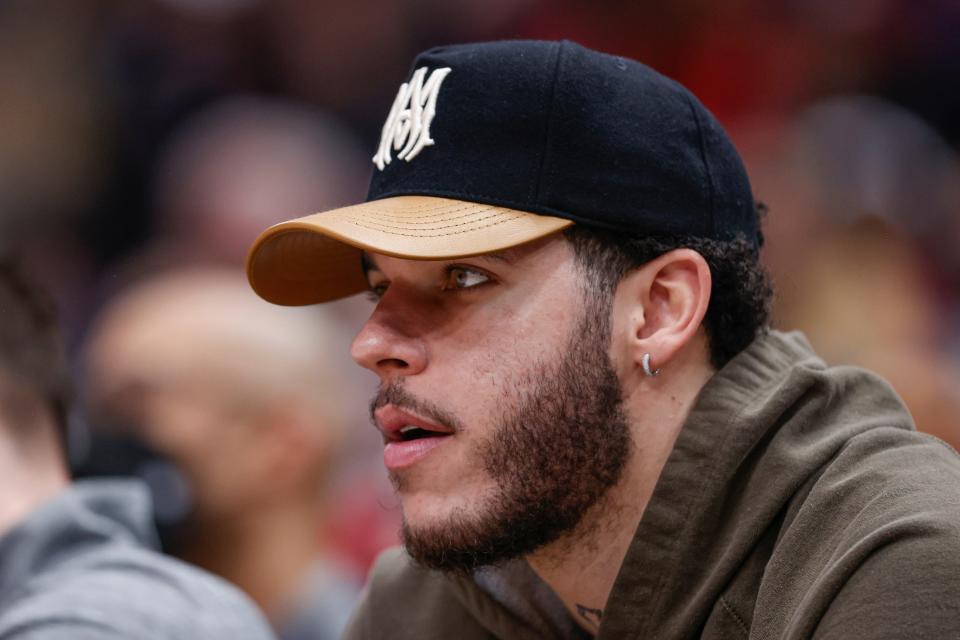 Injured Chicago Bulls guard Lonzo Ball sits on the bench during a game against the Oklahoma City Thunder at United Center on Jan. 13, 2023.