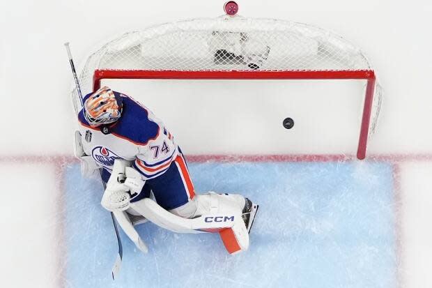 A puck shot by Florida Panthers centre Evan Rodirgues is seen getting past Edmonton Oilers goalie Stuart Skinner during the first game of the Stanley Cup final last Saturday. The Oilers lost the series opener to the Panthers 3-0. Canadian music superstar Drake has placed a $500,000 US bet on the Oilers winning the Cup.