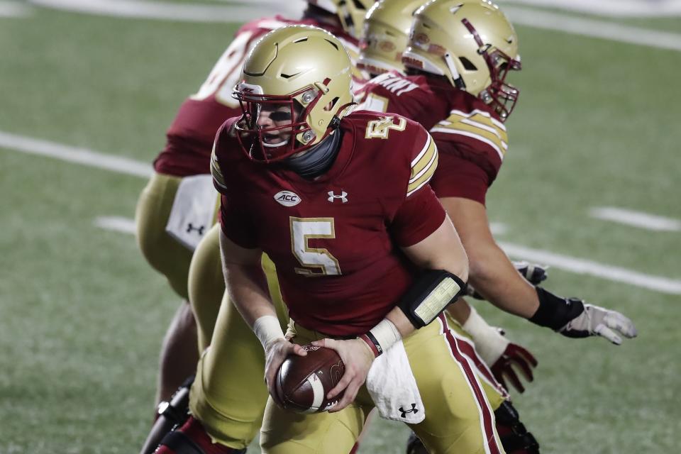 Boston College quarterback Phil Jurkovec (5) looks to the backfield during the second half of the team's NCAA college football game against Louisville, Saturday, Nov. 28, 2020, in Boston. (AP Photo/Michael Dwyer)