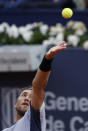 Casper Ruud of Norway serves to Stefanos Tsitsipas of Greece during the final of the Barcelona Open tennis tournament in Barcelona, Spain, Sunday, April 21, 2024. (AP Photo/Joan Monfort)
