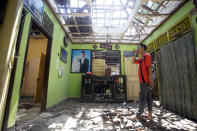 <p>A villager visits his damaged house in the Kekait village affected by Sunday’s earthquake in North Lombok, Indonesia, Wednesday, Aug. 8, 2018. (Photo: Firdia Lisnawati/AP) </p>