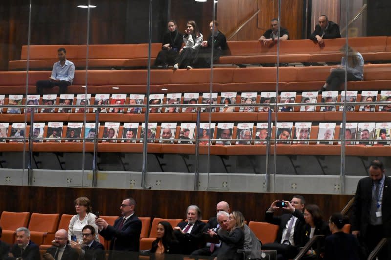 Photos of Israeli hostages held by Hamas in Gaza are displayed on seats in the Knesset on Wednesday. Photo by Debbie Hill/ UPI