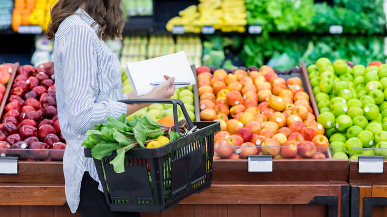 person shopping with shopping list