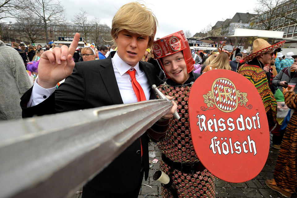 <p>A costumed revellers dressed as U.S. President Donald J. Trump (L) celebrates carnival at the Alter Markt (Old Market square) in Cologne, Germany, Feb. 23, 2017. (Photo: Sascha Steinbach/EPA) </p>