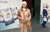 Arlette Mattar, mother of three, poses for a picture during an interview with Reuters outside a supermarket in Beirut,