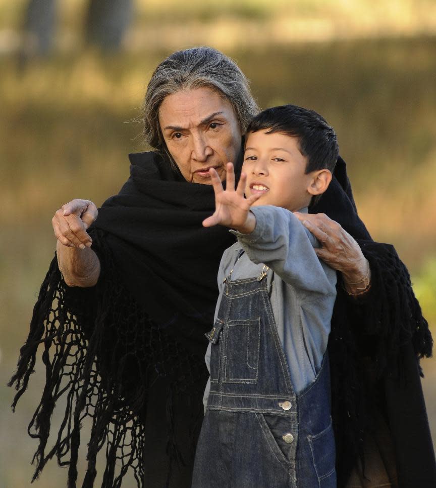 This film image released by Arenas Entertainment shows Luke Ganalon, right, and Miriam Colon in a scene from "Bless Me, Ultima." (AP Photo/Arenas Entertainment)