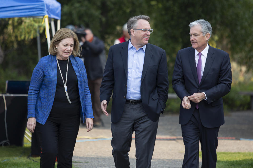 From left, Esther George, President and CEO of the Federal Reserve Bank of Kansas City, John Williams, President and CEO of the Federal Reserve Bank of New York, and Jerome Powell, Chairman of the Board of Governors of the Federal Reserve System walk together on Friday, Aug. 24, 2018 in Jackson Hole, Wyo. (AP Photo/Jonathan Crosby)