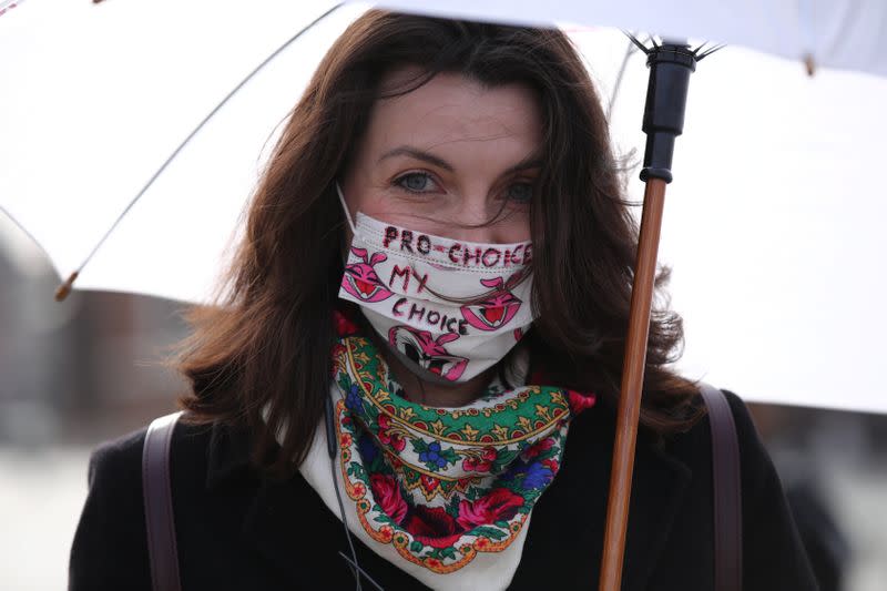 An activist protests against an initiative to tighten abortion rules in Krakow