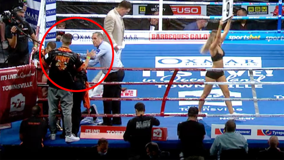 Pictured here, Jeff Horn's cornerman waves for the referee to stop the fight.