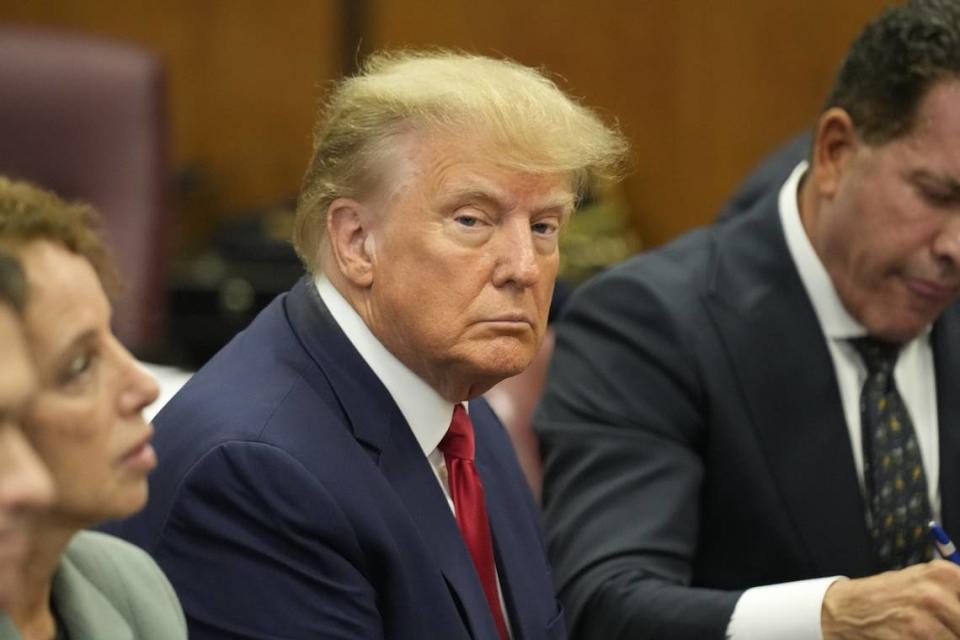 Former US President Donald J. Trump sits in the courtroom with his attorneys, including Todd Blanche (right) for his arraignment at the Manhattan Criminal Court on Tuesday, April 4, 2023, in New York. Blanche was part of Trump’s legal team Tuesday for an initial court appearance in Miami.