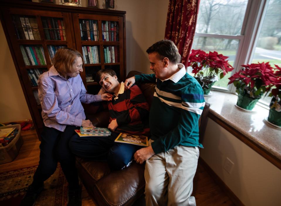 Dan and Dodie Maillet spend time with their son Matt, 31, in their Irvington home March 6, 2024. Matt, who has autism and Prader-Willie Syndrome, enjoys going to libraries, and especially likes a music program at the West Harrison Library. The library has informed his aide that because he is an adult, he is not allowed in the childrenÕs room at the library. His parents are hoping that the library will change their policy and allow Dan to attend programs in the childrenÕs library.