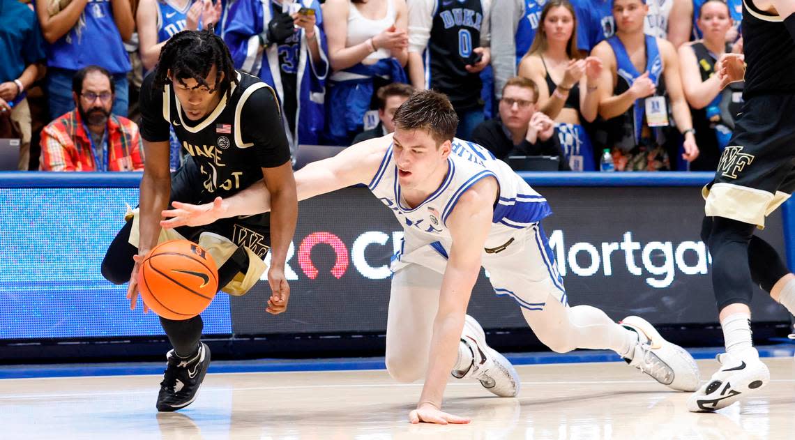 Duke’s Kyle Filipowski (30) and Wake Forest’s Tyree Appleby (1) go after the ball during the second half of Duke’s 75-73 victory over Wake Forest at Cameron Indoor Stadium in Durham, N.C., Tuesday, Jan. 31, 2023.